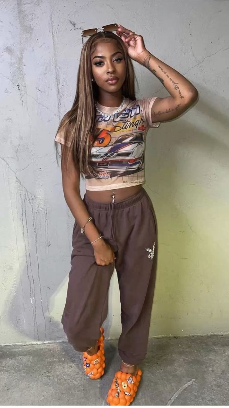 Crop Top with Brown Joggers and Orange Bubble Slide